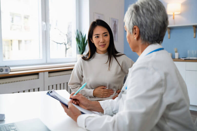 A female patient is discussing her health with an internal medicine doctor during her Annual Physical Exam.